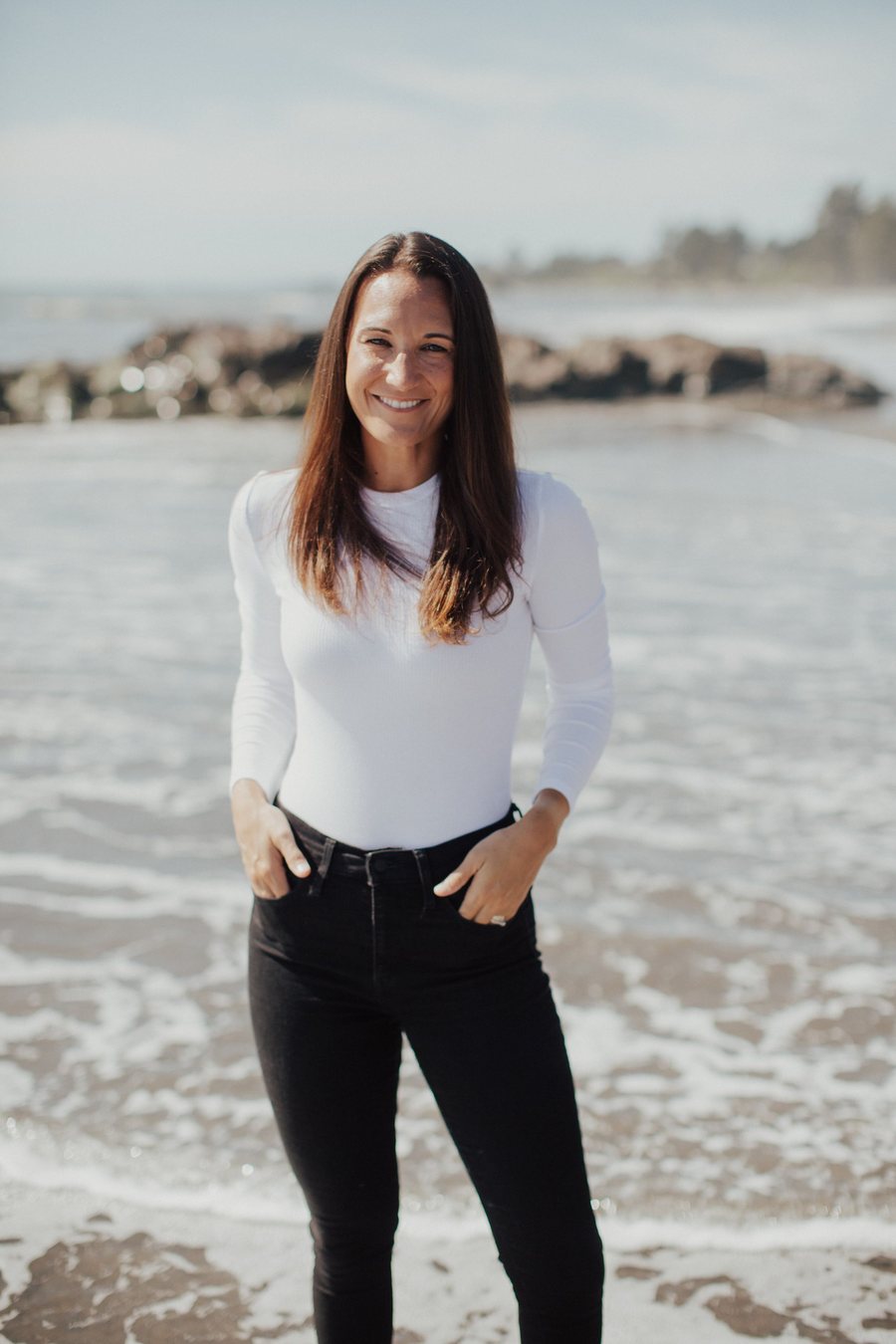 Stephanie Gotzman, owner and CPR instructor for First Response First Aid & CPR, standing outdoors near the ocean